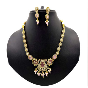 Elegant Temple Jewellery Set with Gold Finish and Pink Gemstone Accents